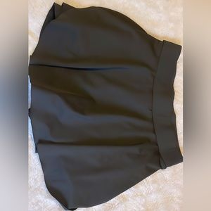 Flowy black sports skirt with built in shorts